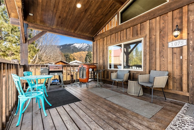 wooden terrace with a mountain view