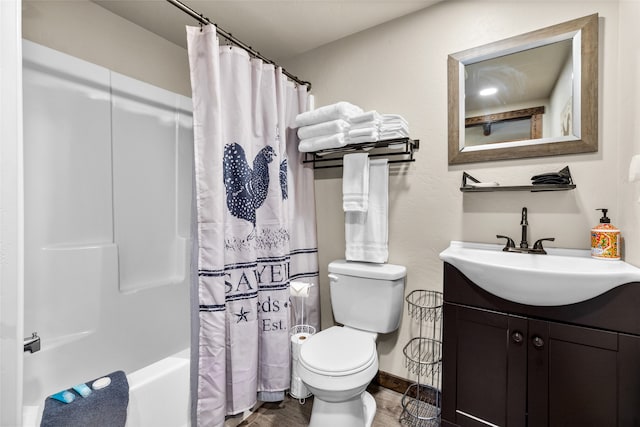 full bathroom featuring shower / bath combination with curtain, toilet, and vanity with extensive cabinet space