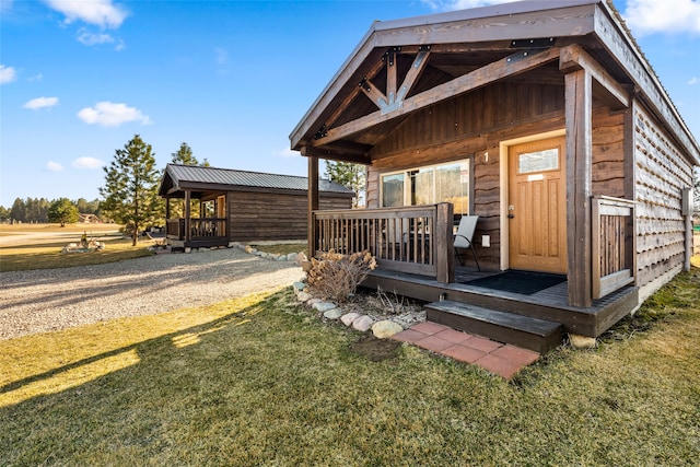 exterior space featuring a deck and a yard