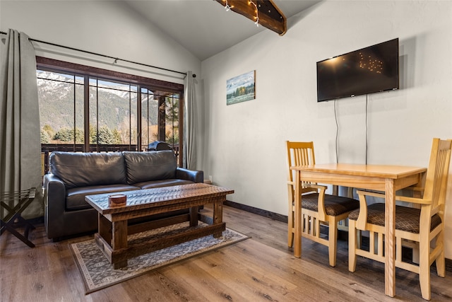 living room featuring high vaulted ceiling, dark wood-type flooring, and beamed ceiling