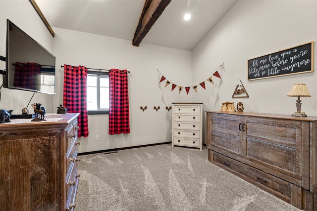 carpeted bedroom featuring beamed ceiling