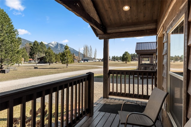 wooden deck featuring a mountain view