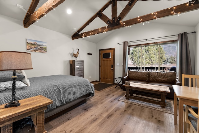 bedroom with high vaulted ceiling, dark hardwood / wood-style flooring, and beam ceiling