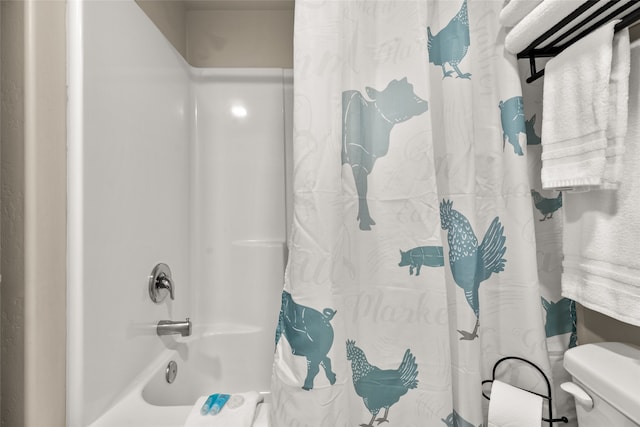 bathroom with shower / tub combo with curtain and toilet