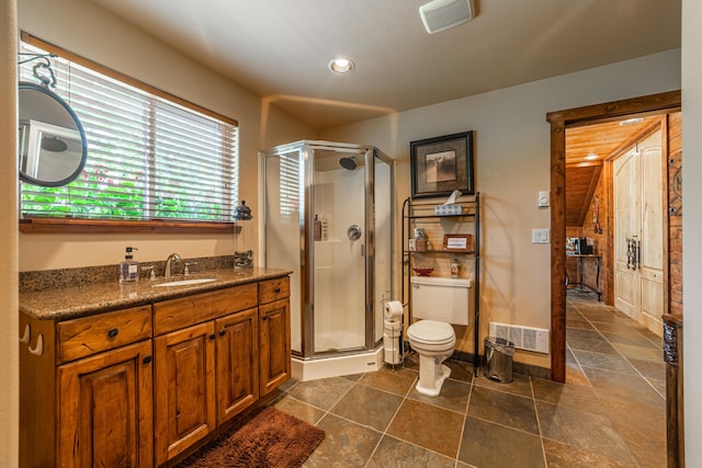 bathroom with walk in shower, vanity, toilet, and tile floors