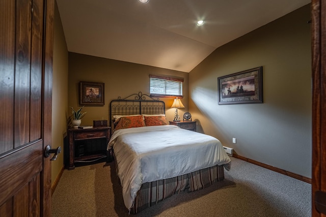 carpeted bedroom with vaulted ceiling and baseboard heating