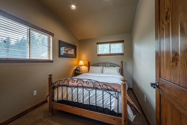 carpeted bedroom featuring vaulted ceiling