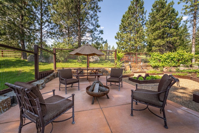 view of patio / terrace featuring an outdoor fire pit