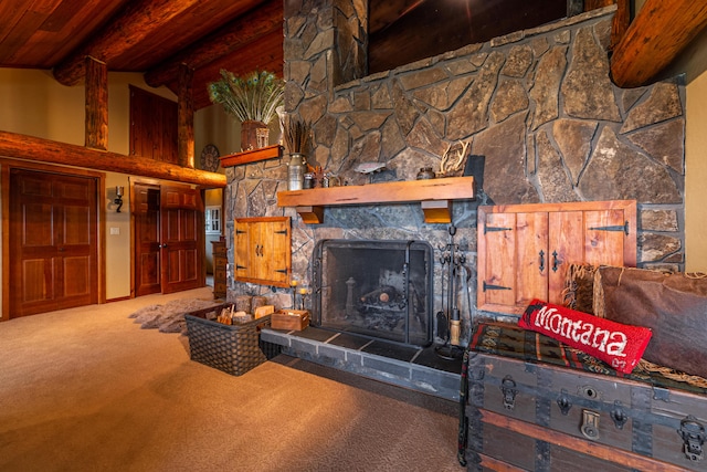 living room featuring beamed ceiling, a fireplace, a towering ceiling, and carpet flooring