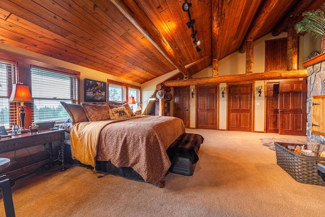 carpeted bedroom featuring wood ceiling, rail lighting, and vaulted ceiling with beams