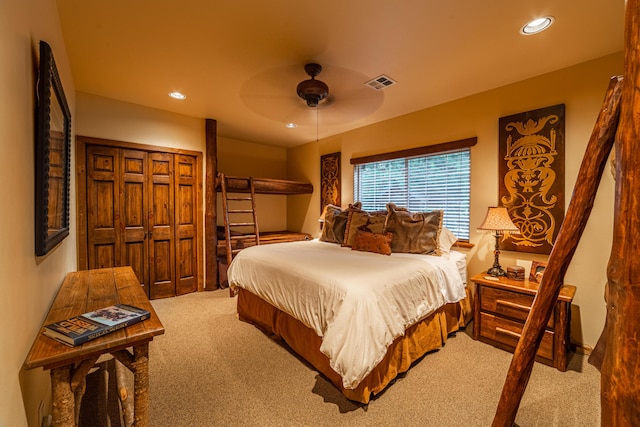 bedroom with light carpet, a closet, and ceiling fan