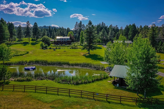 exterior space featuring a rural view and a lawn