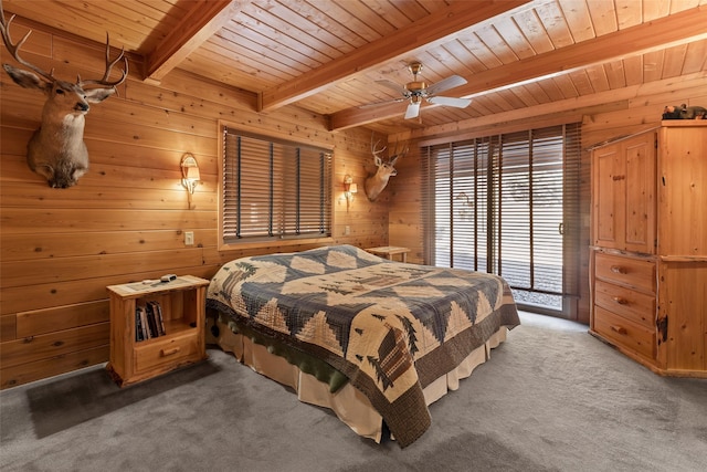 bedroom featuring wood ceiling, beamed ceiling, multiple windows, and dark colored carpet