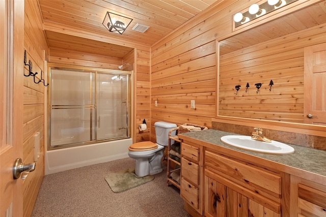 full bathroom featuring wood ceiling, shower / bath combination with glass door, toilet, and wooden walls