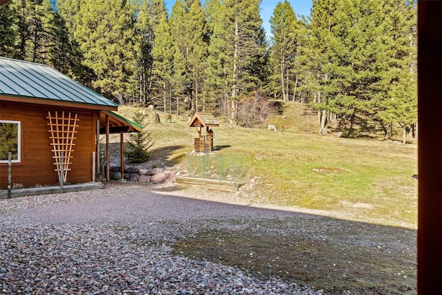 964 Elkhorn Rd, Seeley Lake, MT 59868 - view of grassy yard with a view of trees