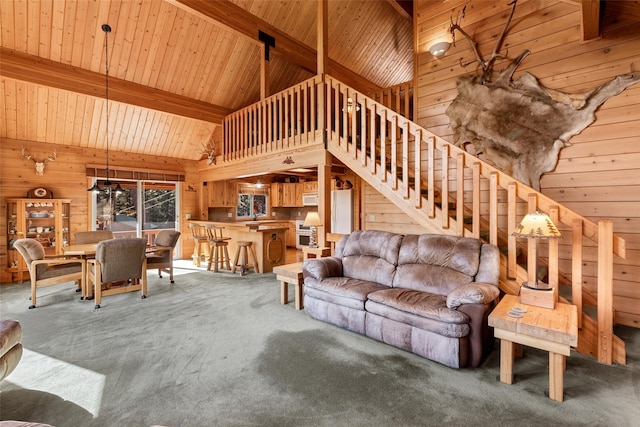 carpeted living room featuring wooden ceiling, wood walls, beam ceiling, and high vaulted ceiling