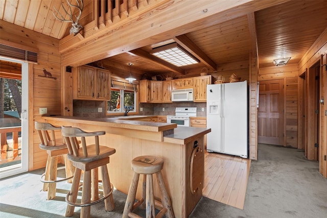 964 Elkhorn Rd, Seeley Lake, MT 59868 - kitchen with white appliances, a wooden ceiling with exposed beams, wood walls, decorative backsplash, and a peninsula