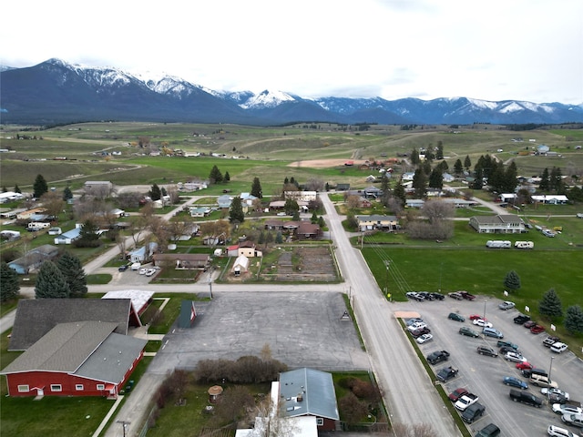 birds eye view of property featuring a mountain view