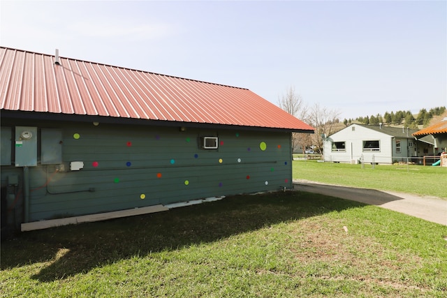 view of home's exterior with a yard