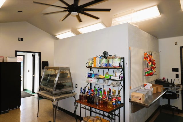 interior space with lofted ceiling and ceiling fan