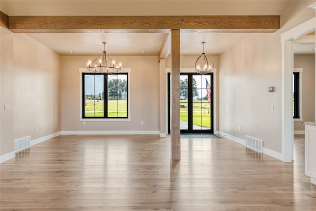 1052 Foxtail Dr, Kalispell, MT 59901 - unfurnished dining area with a notable chandelier, beam ceiling, and visible vents