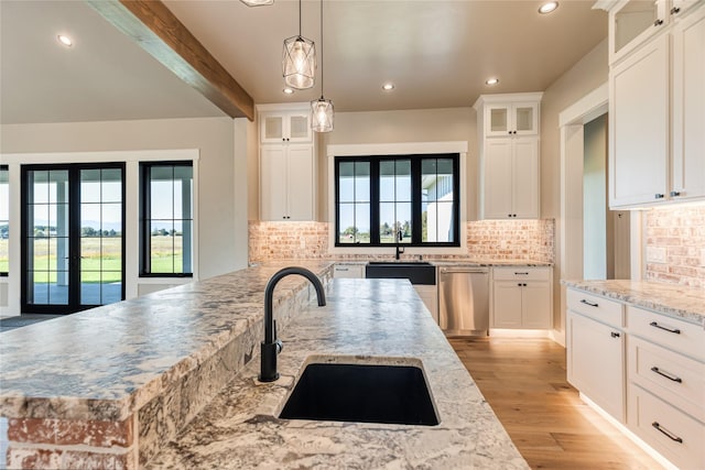 1052 Foxtail Dr, Kalispell, MT 59901 - kitchen with recessed lighting, dishwasher, plenty of natural light, and a sink