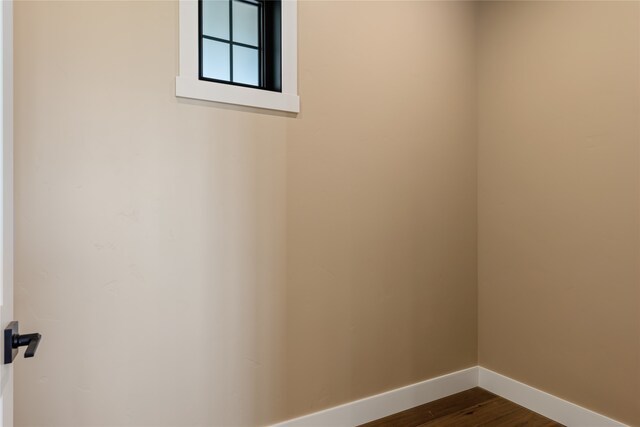 empty room with wood-type flooring