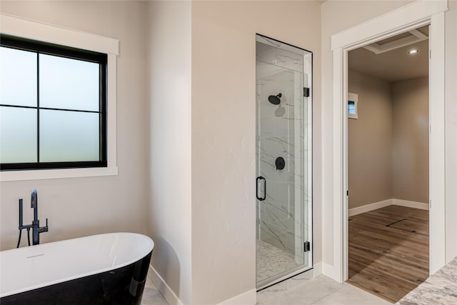 1052 Foxtail Dr, Kalispell, MT 59901 - full bathroom featuring baseboards, a shower stall, and a freestanding bath