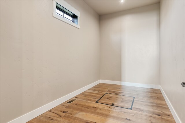 spare room with wood-type flooring