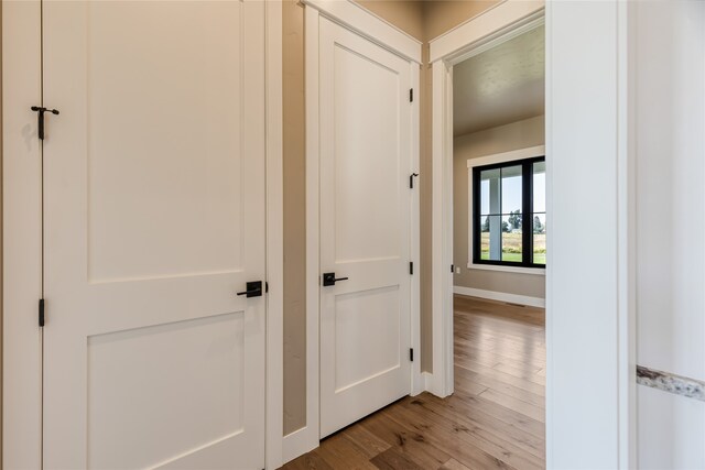 hall with light wood-type flooring