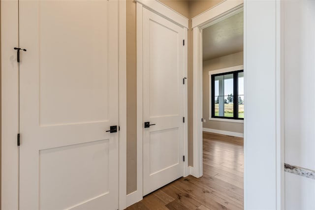 1052 Foxtail Dr, Kalispell, MT 59901 - hallway featuring light wood-style flooring and baseboards