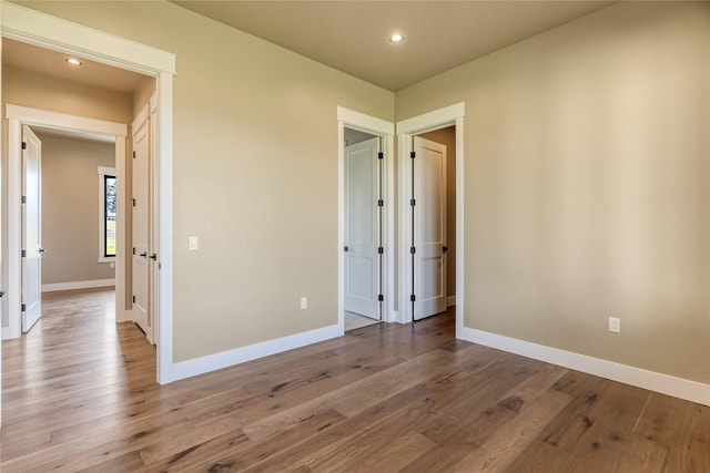 1052 Foxtail Dr, Kalispell, MT 59901 - spare room with recessed lighting, wood finished floors, and baseboards