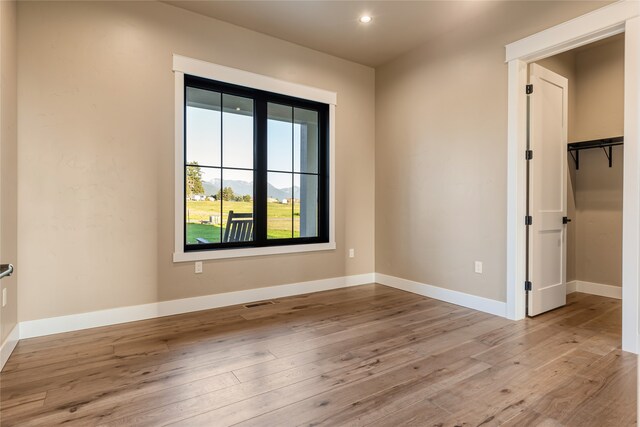 spare room featuring light wood-type flooring