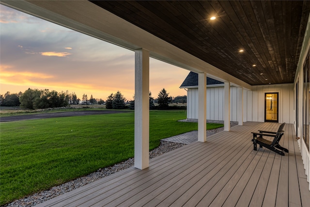 deck at dusk with a lawn