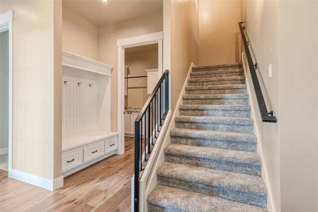 staircase featuring hardwood / wood-style floors