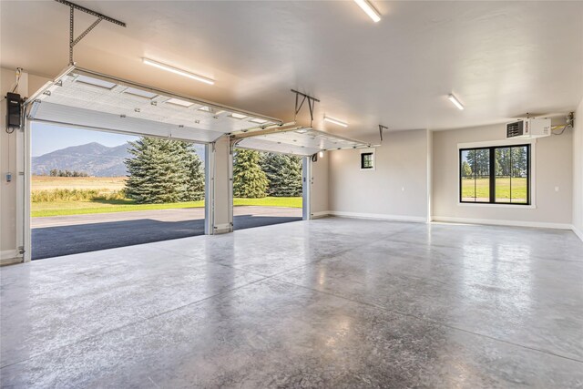 1052 Foxtail Dr, Kalispell, MT 59901 - garage with baseboards and a mountain view