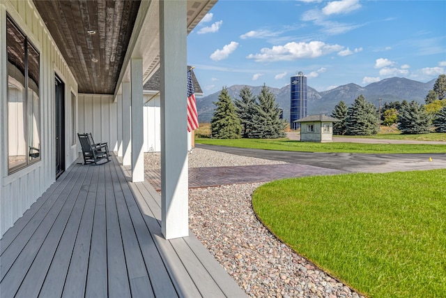 1052 Foxtail Dr, Kalispell, MT 59901 - wooden deck with a mountain view and a yard