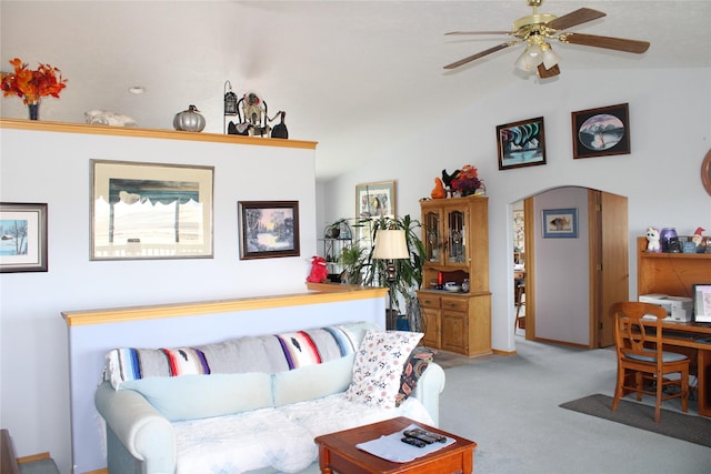 95 Furman Ln, East Helena, MT 59635 - living area with vaulted ceiling, light carpet, a ceiling fan, and arched walkways