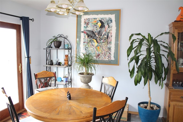 dining space with a notable chandelier