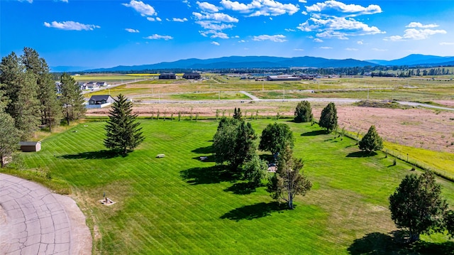 drone / aerial view featuring a mountain view and a rural view