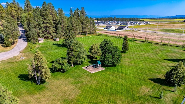 birds eye view of property featuring a mountain view and a rural view