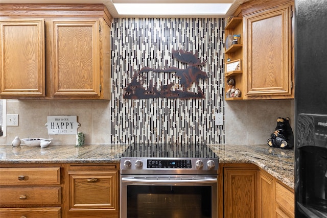 kitchen with tasteful backsplash, stainless steel electric range oven, and light stone counters