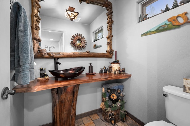 bathroom featuring sink and toilet