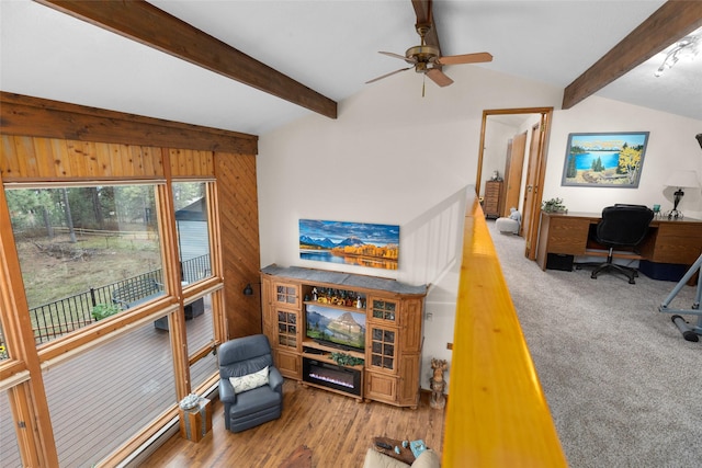 living room with hardwood / wood-style flooring, wood walls, ceiling fan, and vaulted ceiling with beams