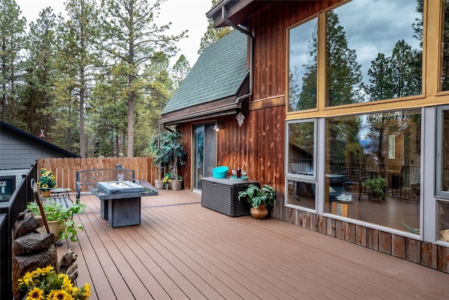 wooden deck featuring a fire pit