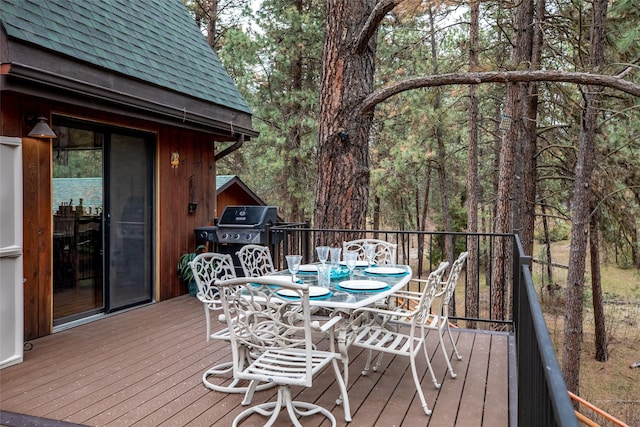 wooden deck featuring area for grilling