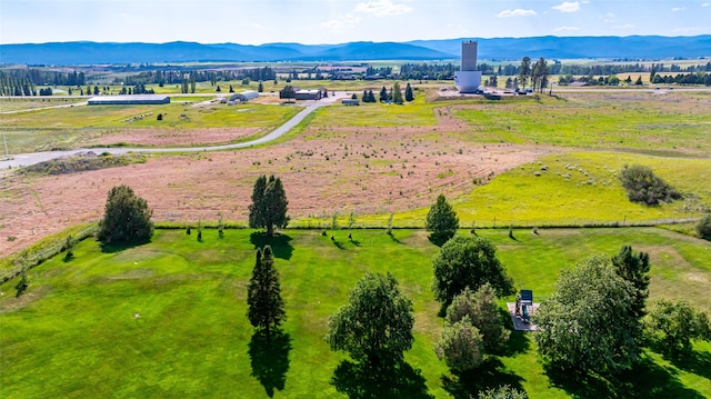 drone / aerial view featuring a rural view and a mountain view