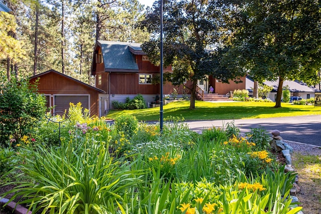 exterior space with a garage and an outdoor structure