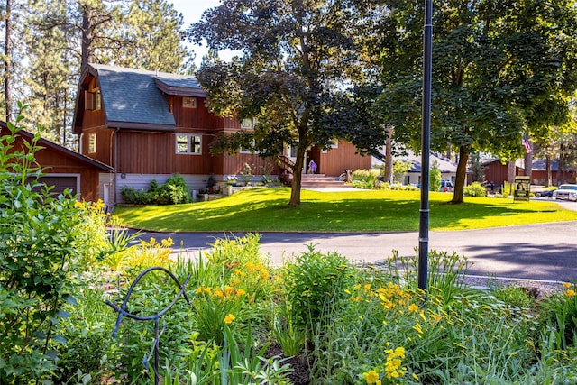 surrounding community with a yard and an outbuilding