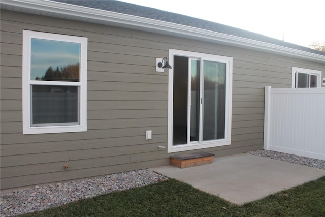 property entrance featuring a patio